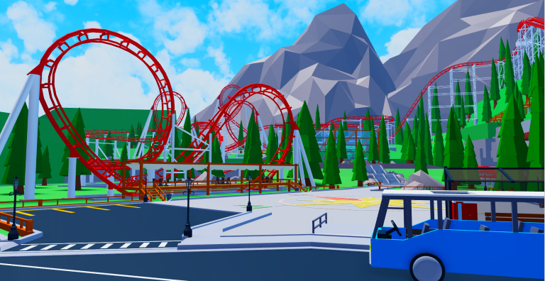 Large red looping roller coaster in the mountains that surrounds a large plaza and cafe.